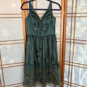 Turquoise dress with gold lace trimming